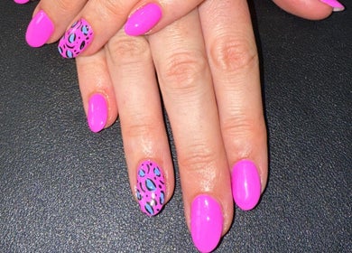 Bold neon pink nails with leopard pattern at Nails By SHTB, Wick, Scotland, GB.
