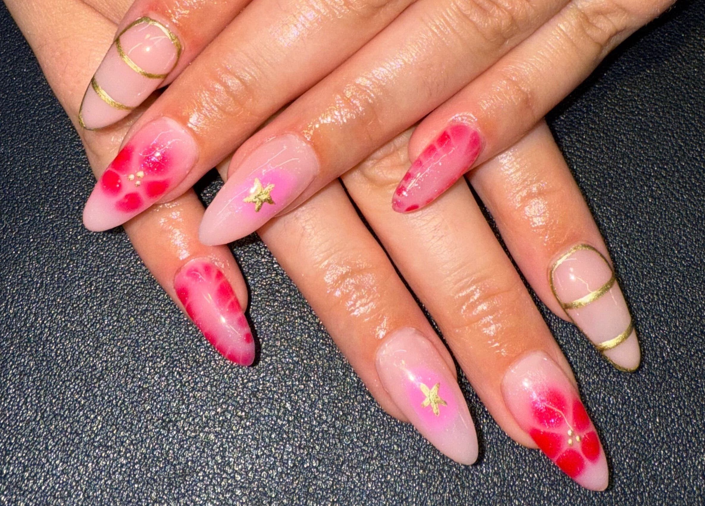 Elegant floral and gold nail art from Nails By SHTB in Wick, Scotland, GB, showcasing detailed hand designs.