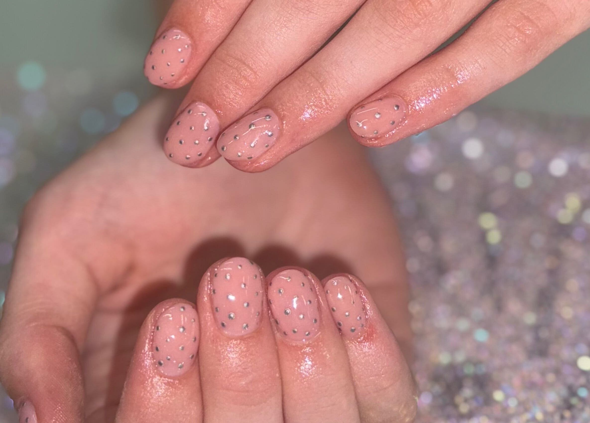 Elegant glitter nails at Nails By SHTB, Wick, Scotland, GB. Soft pink polish with silver accents.