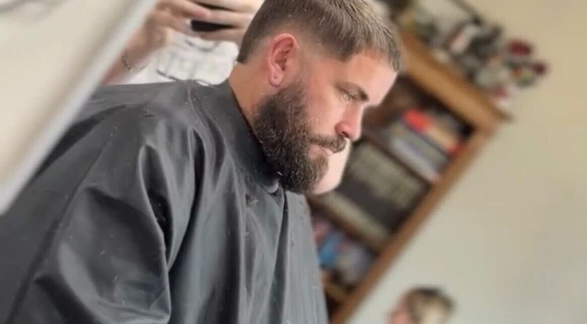 Customer receiving a haircut at Red Rabbit Barber in Langley Moor, England, GB. A beard trim in progress.