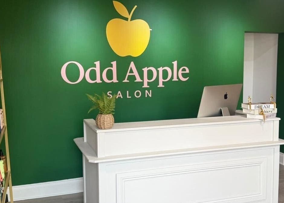 Reception area of Red Rabbit Barber, Langley Moor, England, GB with cozy decor and vibrant green wall.