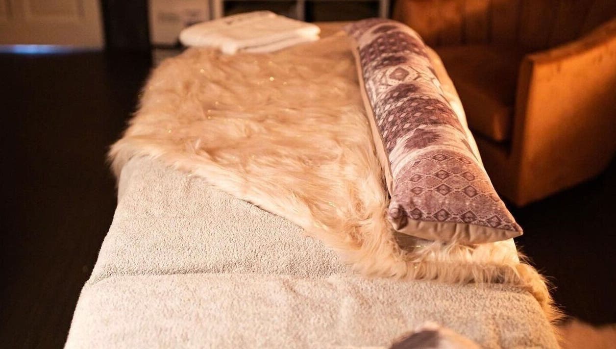 Luxurious massage bed at Divine Beauty Salon, Guernsey, Saint Peter Port, GG, offering relaxation.