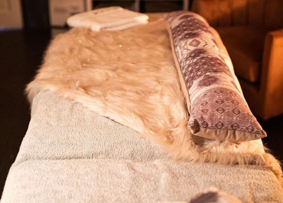 Luxurious massage bed at Divine Beauty Salon, Guernsey, Saint Peter Port, GG, offering relaxation.