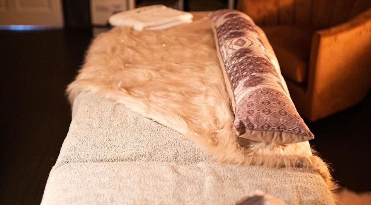 Luxurious massage bed at Divine Beauty Salon, Guernsey, Saint Peter Port, GG, offering relaxation.