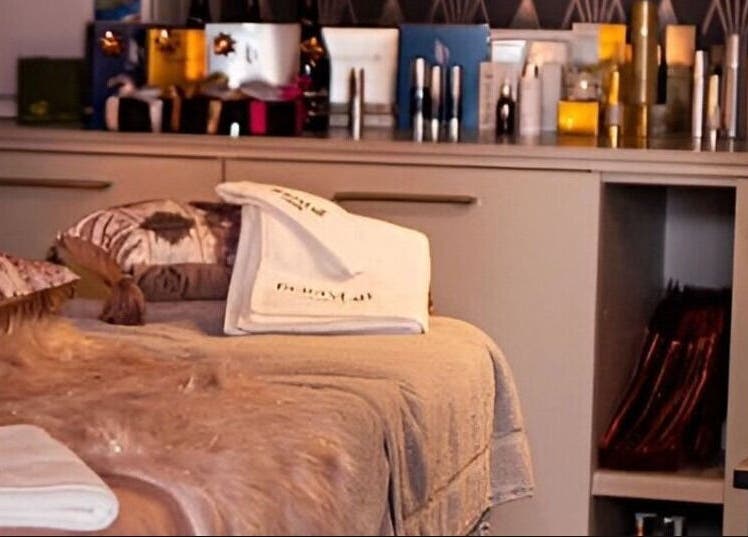 Peaceful treatment room at Divine Beauty Salon, Guernsey, Saint Peter Port, GG with elegant decor and plush towels.