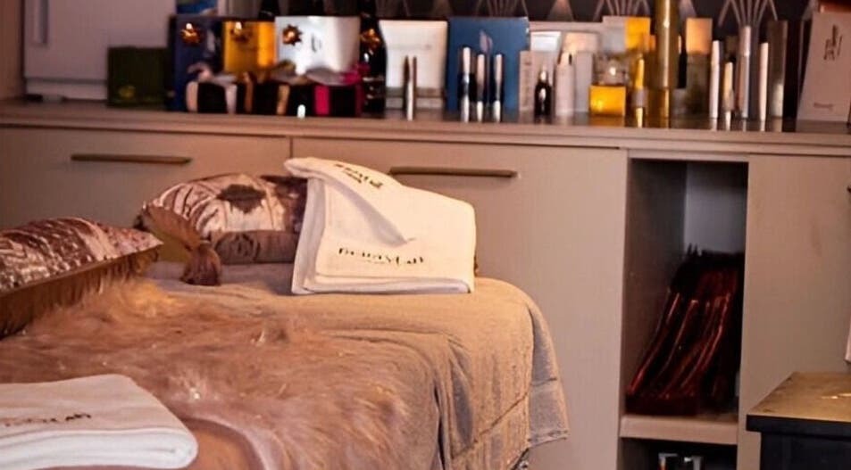 Peaceful treatment room at Divine Beauty Salon, Guernsey, Saint Peter Port, GG with elegant decor and plush towels.