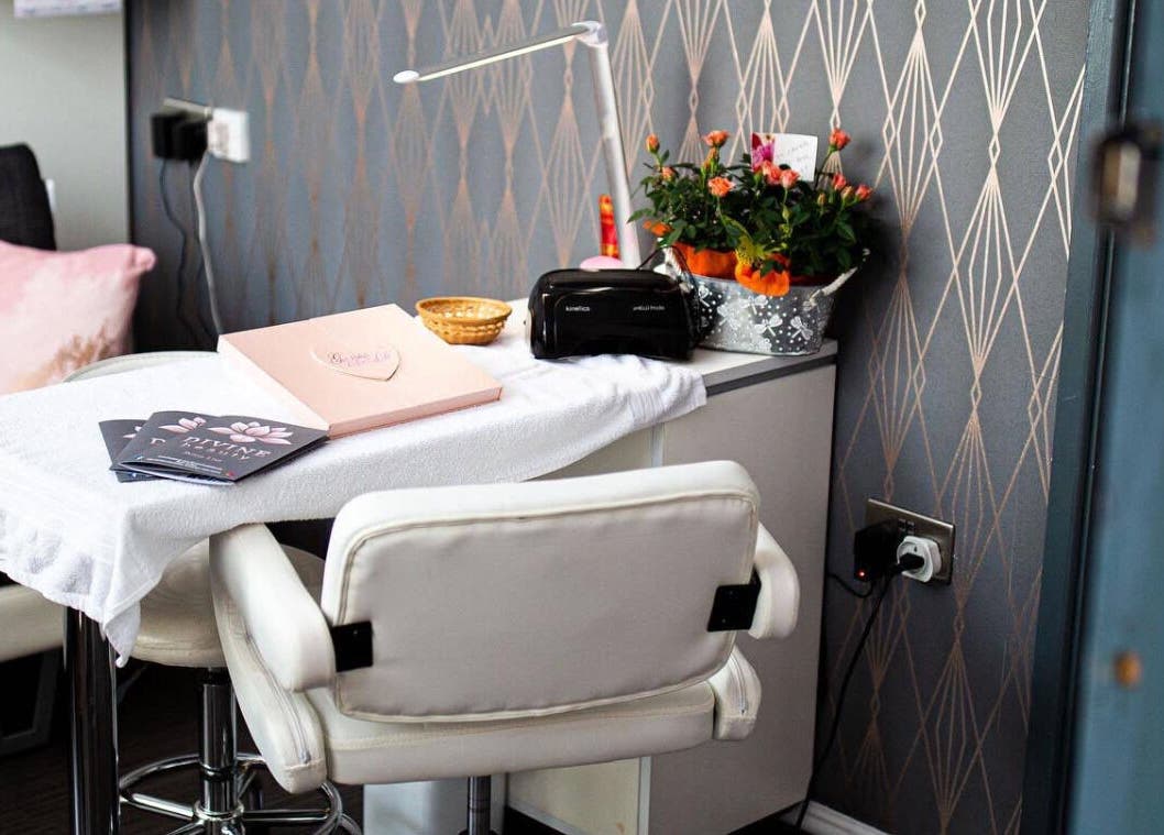 Stylish nail station at Divine Beauty Salon, Guernsey, Saint Peter Port, GG, featuring a comfortable chair and floral decor.