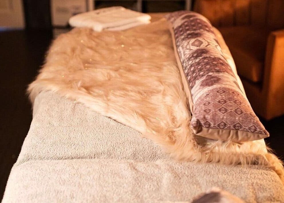 Cozy massage bed at Divine Beauty Salon, Guernsey, Saint Peter Port, GG, invites relaxation and comfort.