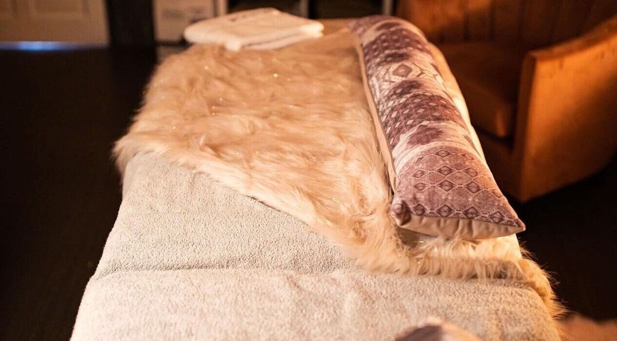 Cozy massage bed at Divine Beauty Salon, Guernsey, Saint Peter Port, GG, invites relaxation and comfort.