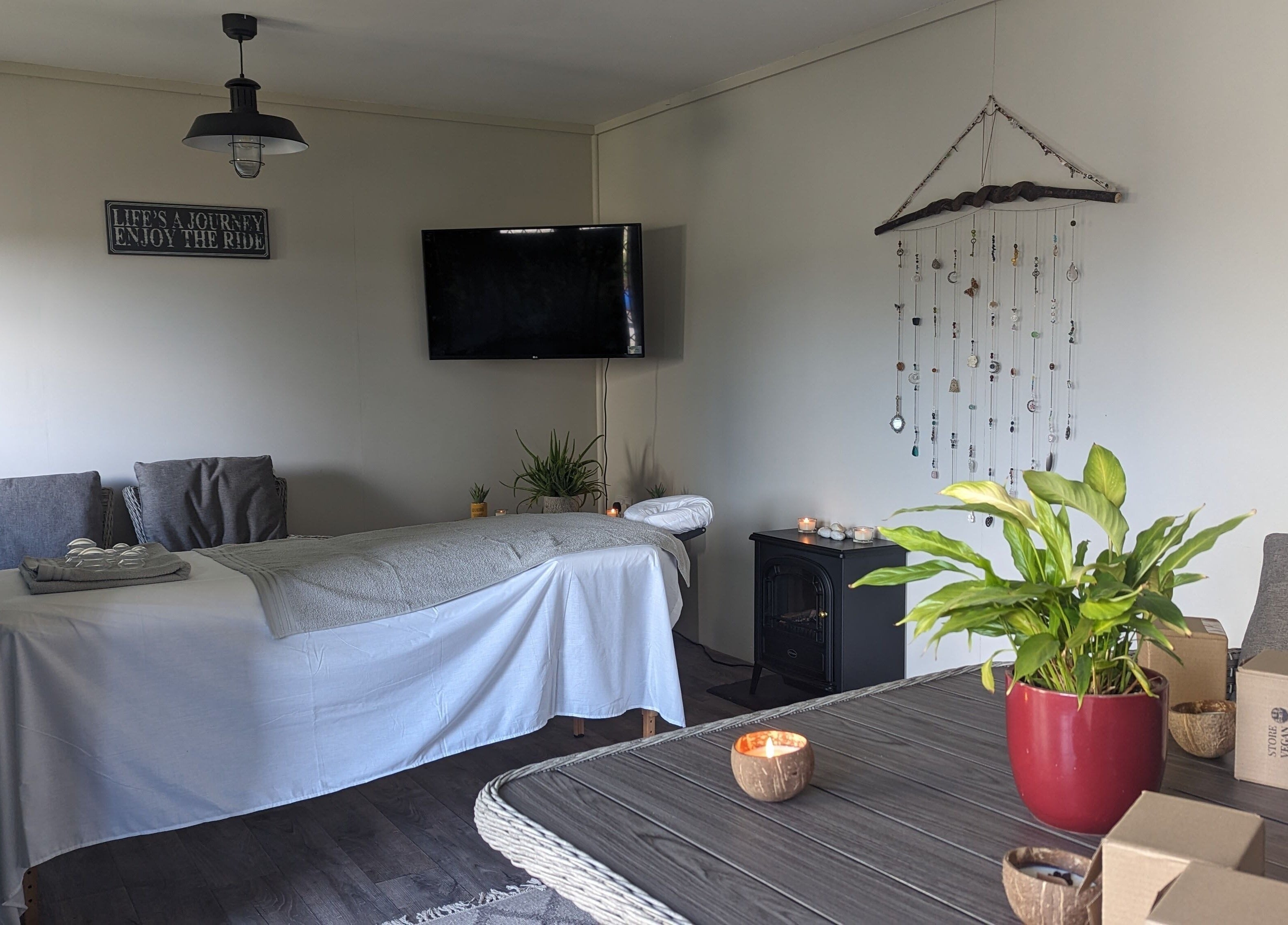Relaxing massage room at The Cabin, Black Notley, England, GB with a cozy setup and calming decor.
