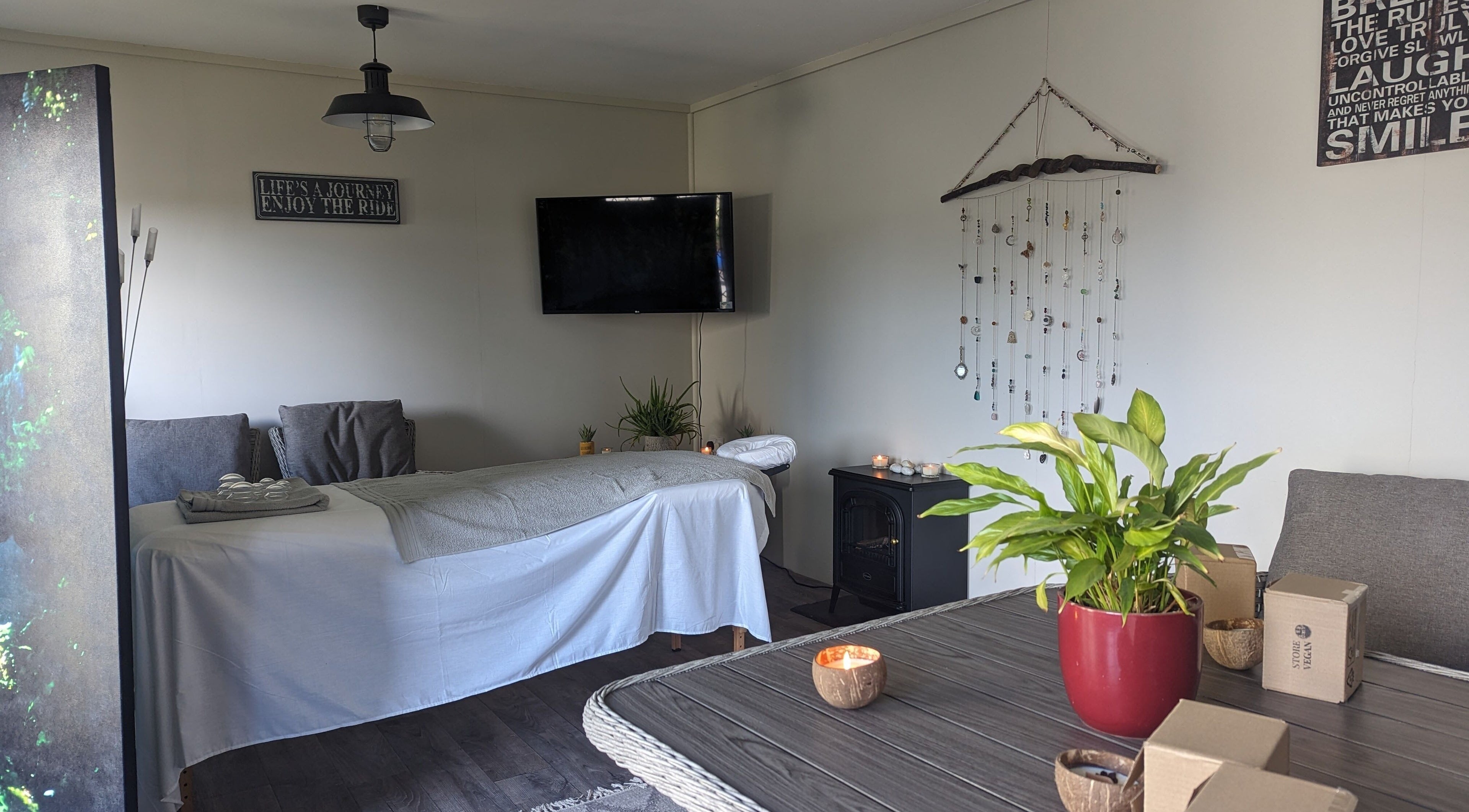 Relaxing massage room at The Cabin, Black Notley, England, GB with a cozy setup and calming decor.