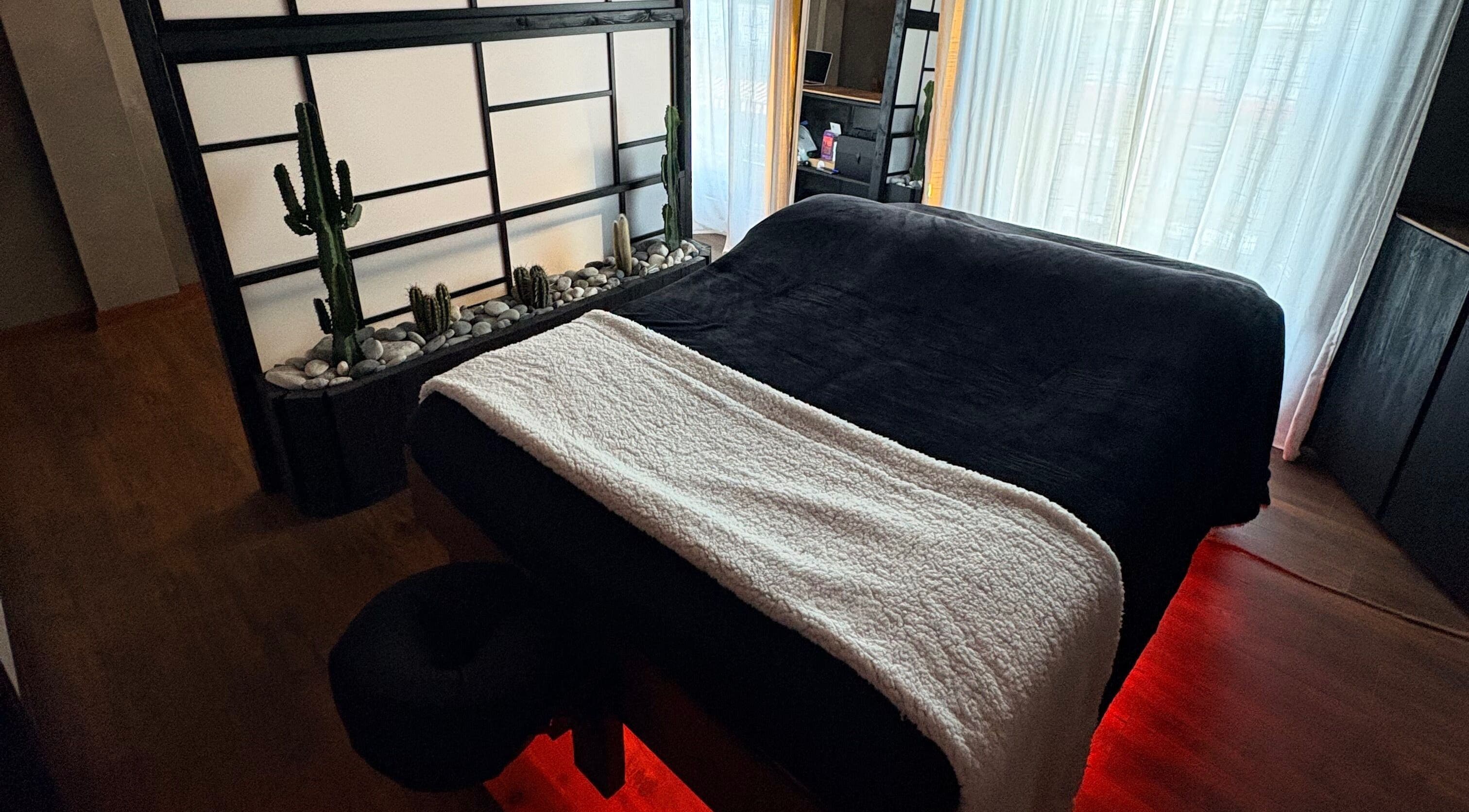 Tranquil massage room at N a n d o | Massage Therapy in Dalkey, County Dublin, IE with serene decor and soft lighting.