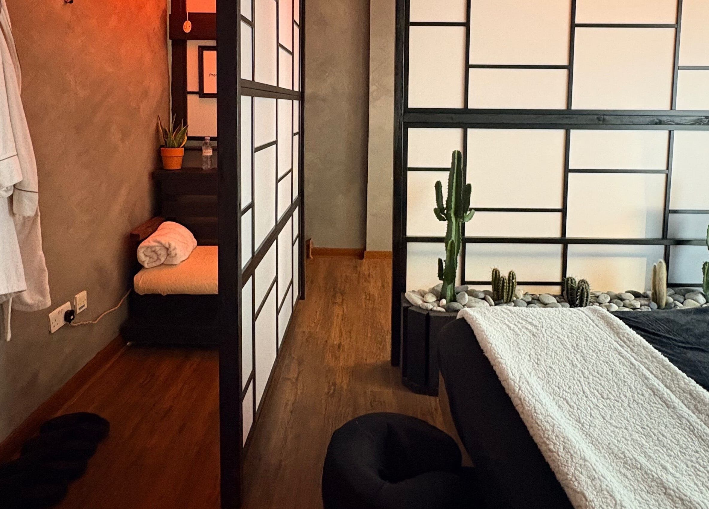 Serene massage room at N a n d o | Massage Therapy in Dalkey, County Dublin, IE, featuring a tranquil ambiance.