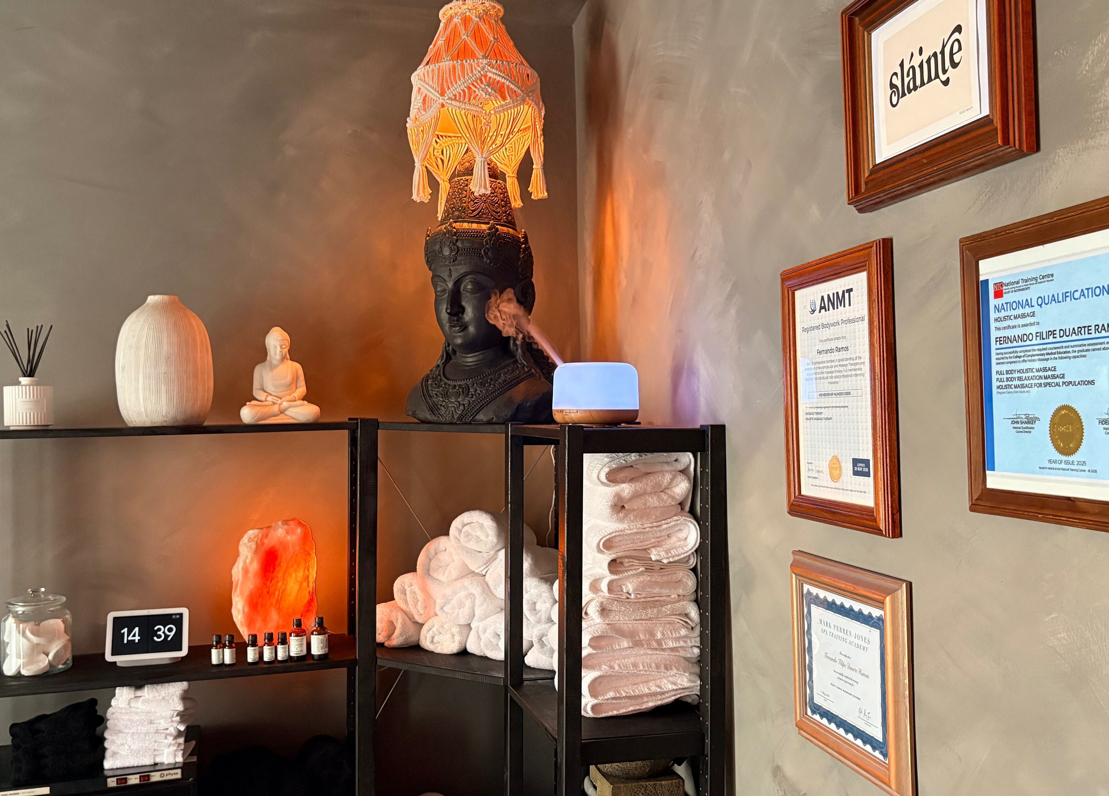 Relaxing Zen corner at N a n d o | Massage Therapy, Dalkey, County Dublin, IE with sculptures and certification frames.