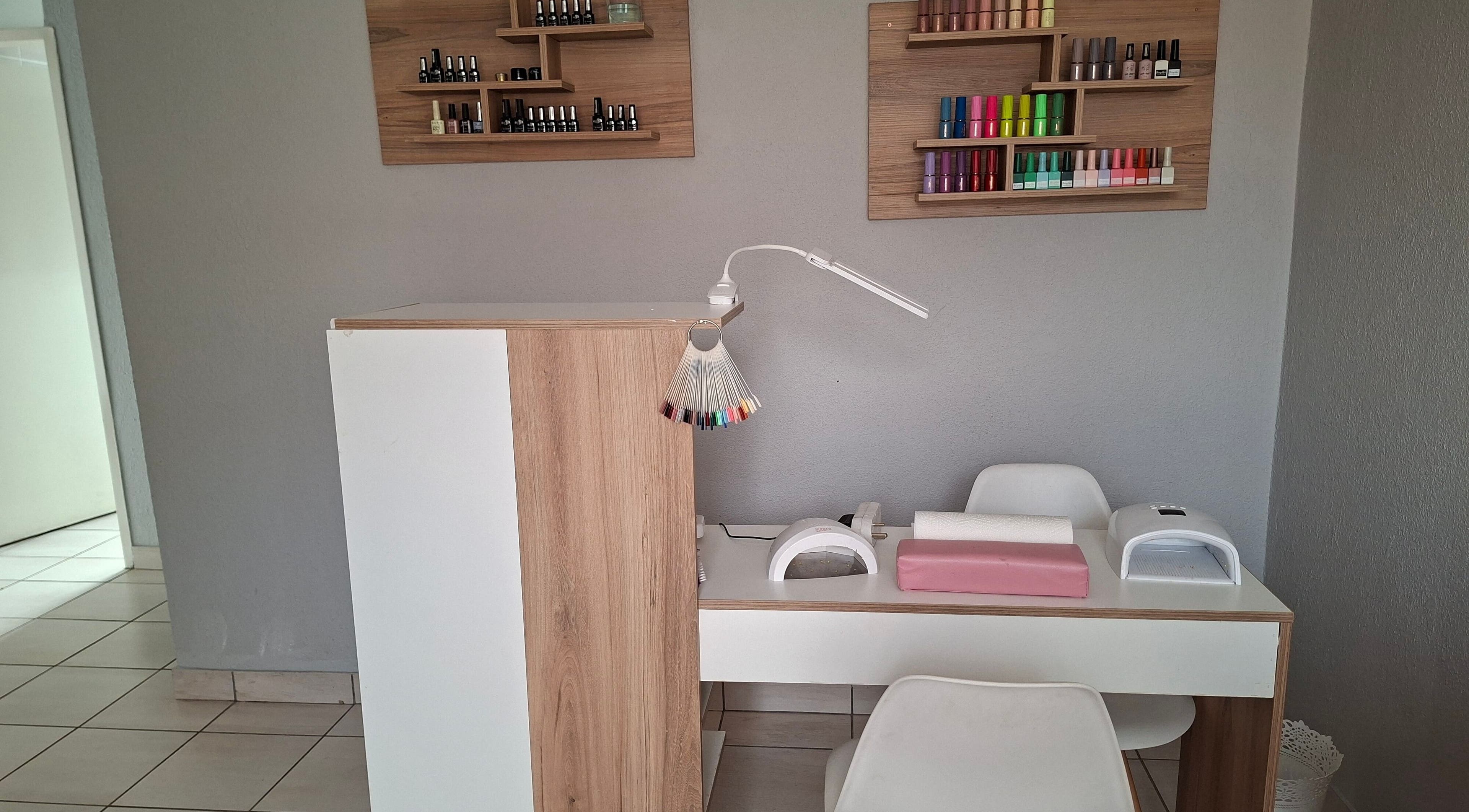 Modern nail station at Evercure Nail Salon, Rustenburg, North West, ZA, with a range of colorful polishes.