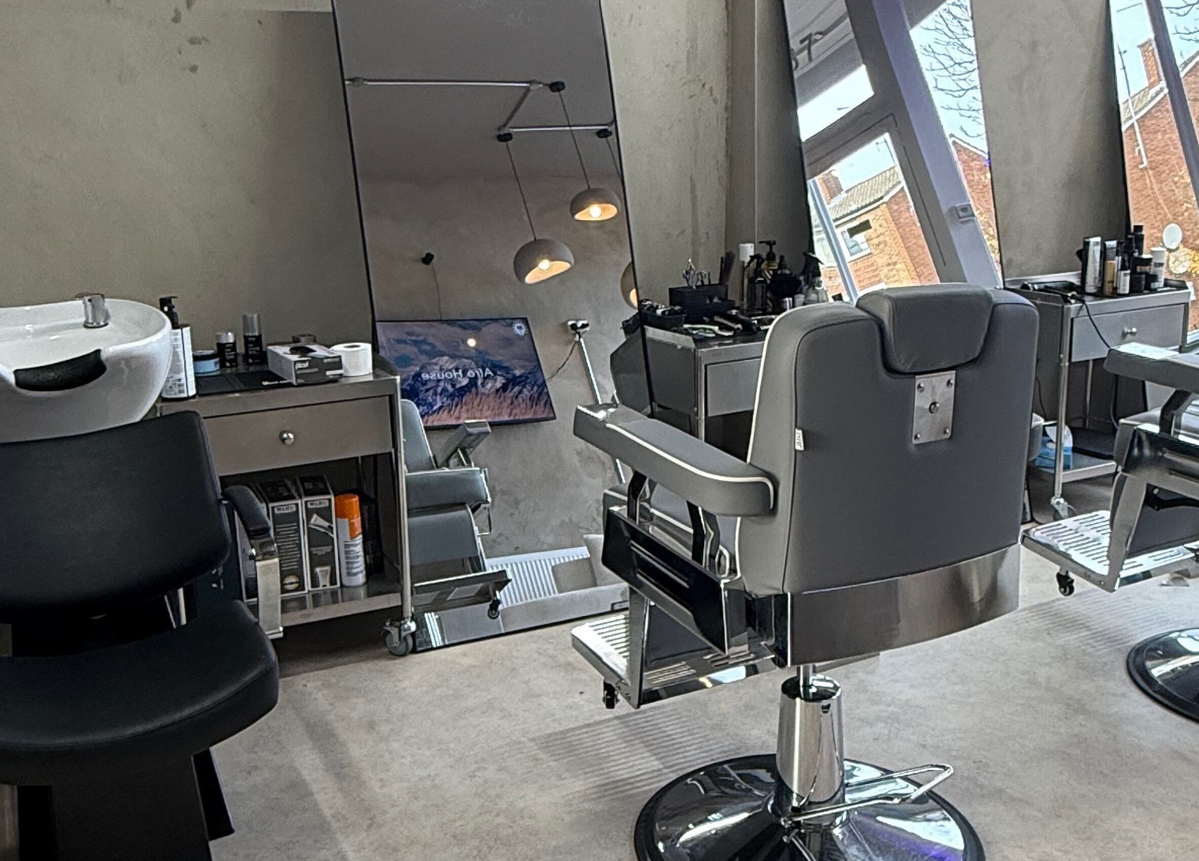 Modern barber chairs and wash station at Mundy Grooming, London, England, GB.