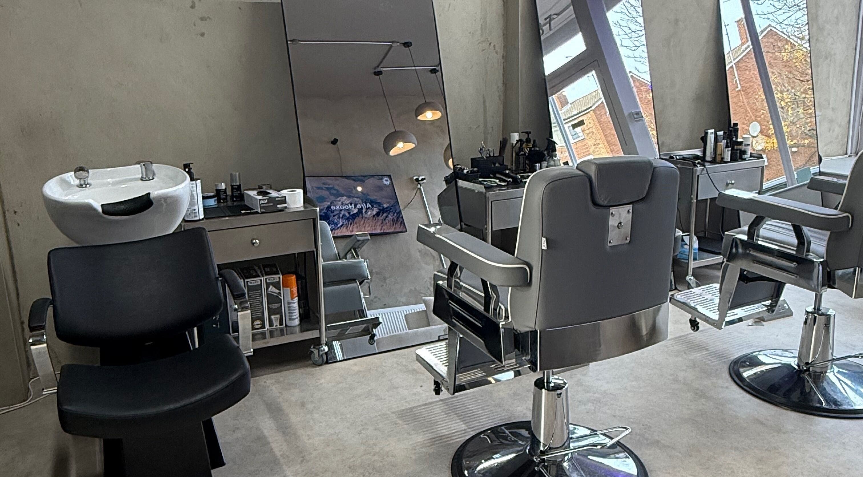 Modern barber chairs and wash station at Mundy Grooming, London, England, GB.