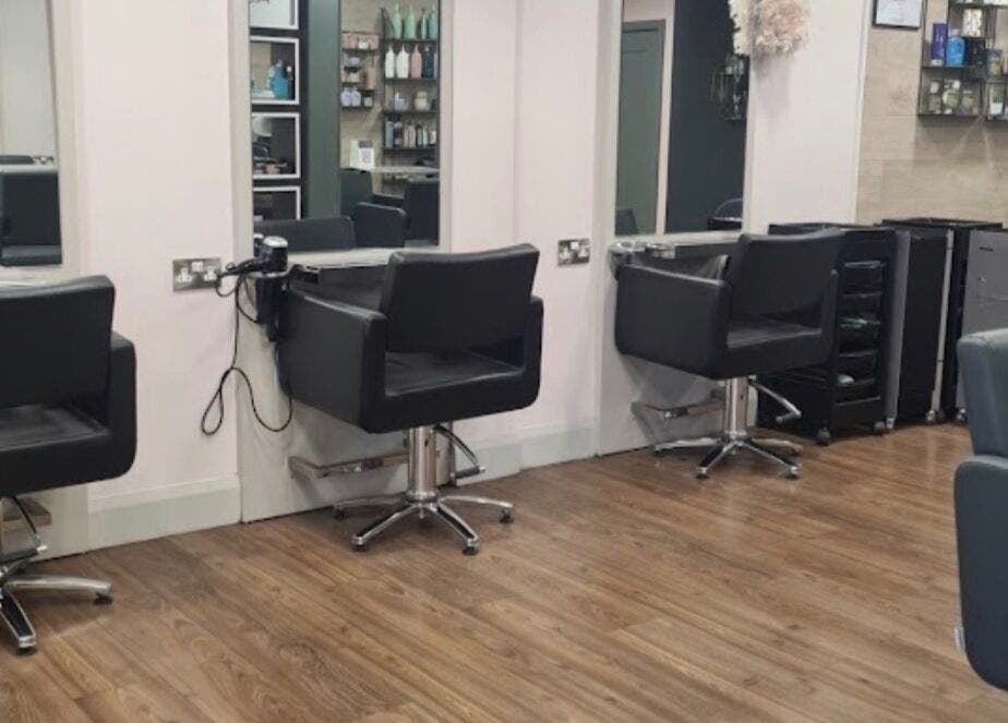 Stylish salon chairs at Blushandbrowstudio, Dublin, County Dublin, IE, with mirrors and wooden floors.