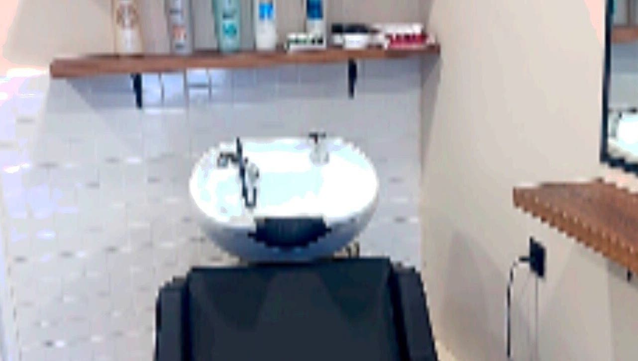 Elegant wash station at Eri hair&style, Kesariani, GR, featuring a stylish basin and grooming products.