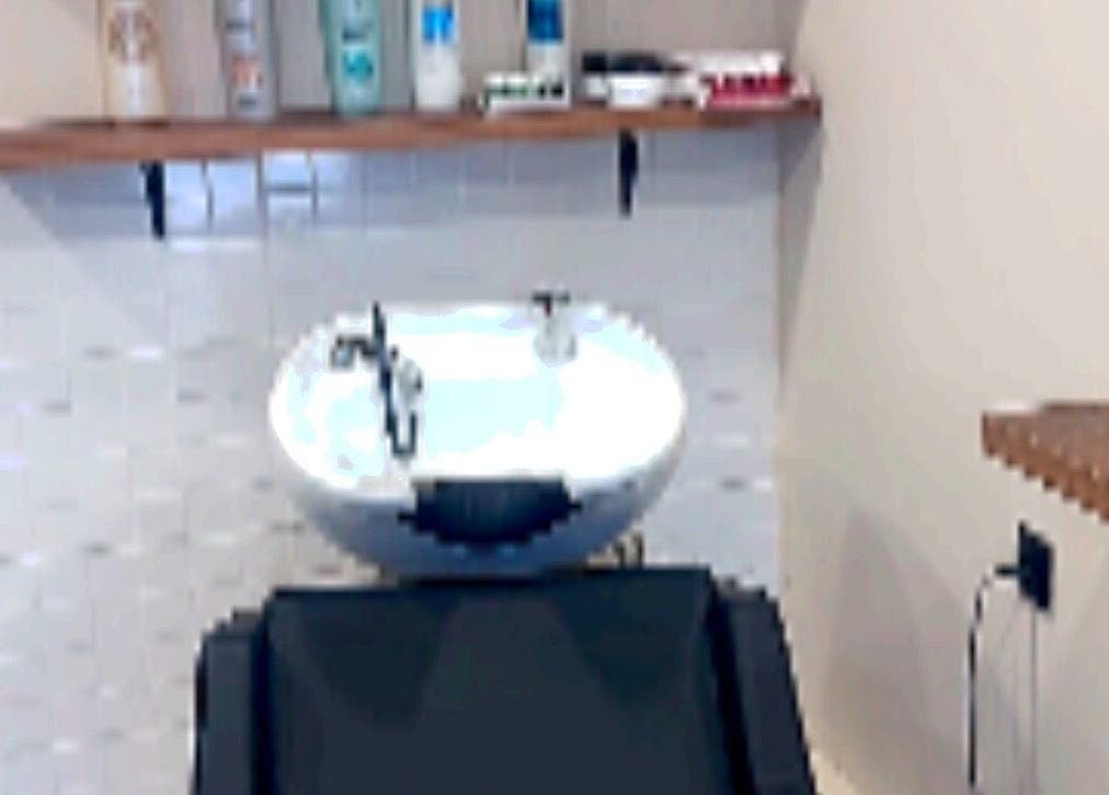 Elegant wash station at Eri hair&style, Kesariani, GR, featuring a stylish basin and grooming products.