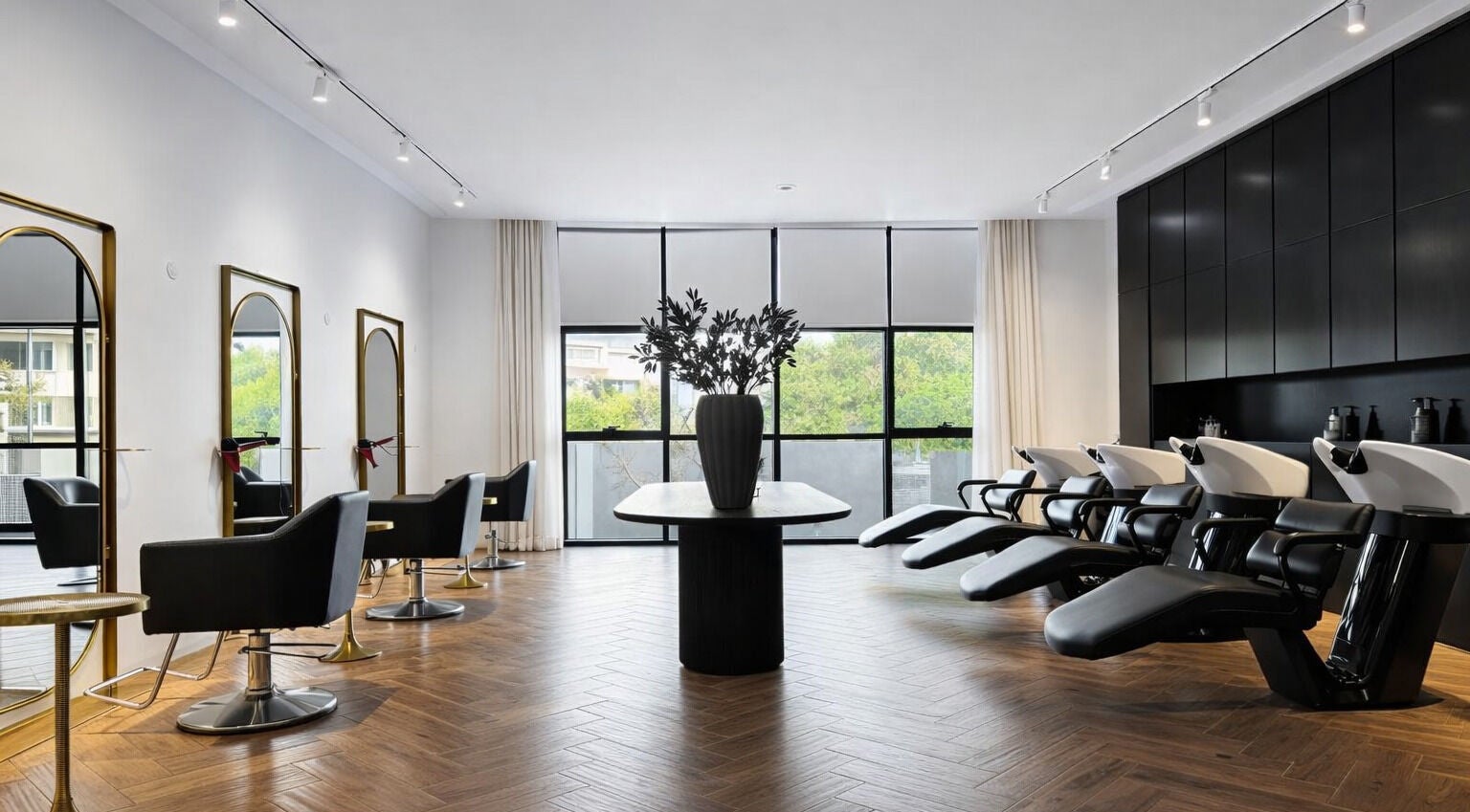 Modern interior of Mariage Beauty Center in Abu Dhabi, AE showcasing chic hair styling stations and wash basins.