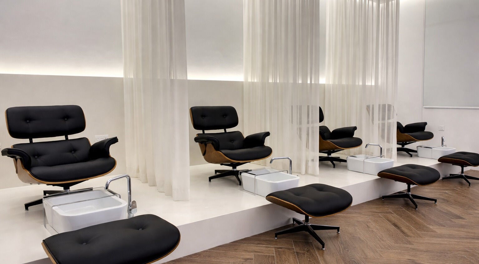 Luxe pedicure chairs at Mariage Beauty Center Abu Dhabi, AE offer relaxation in an elegant setting.