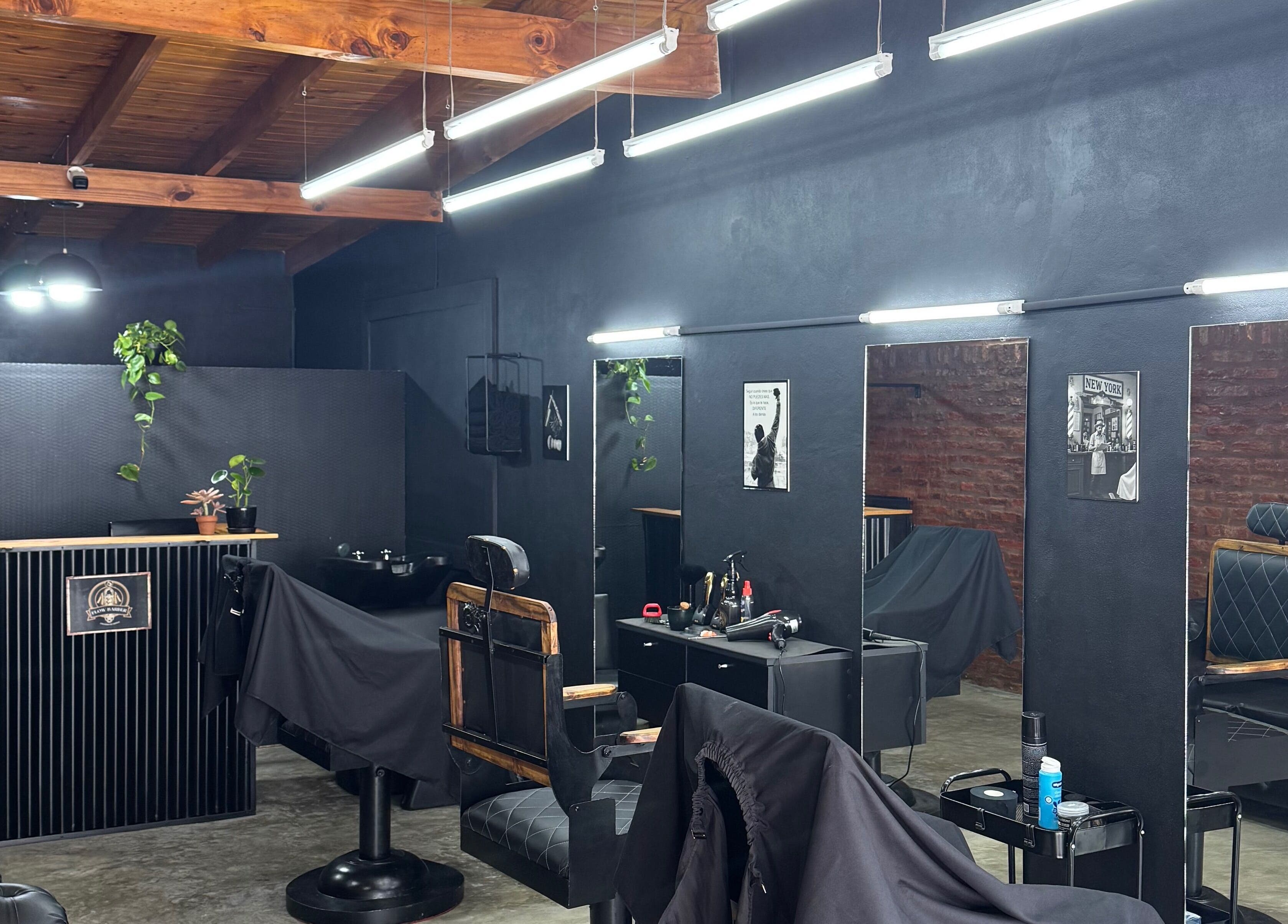 Flowbarber's stylish interior at Villa Astolfi, Provincia De Buenos Aires, AR, featuring modern decor and sleek chairs.