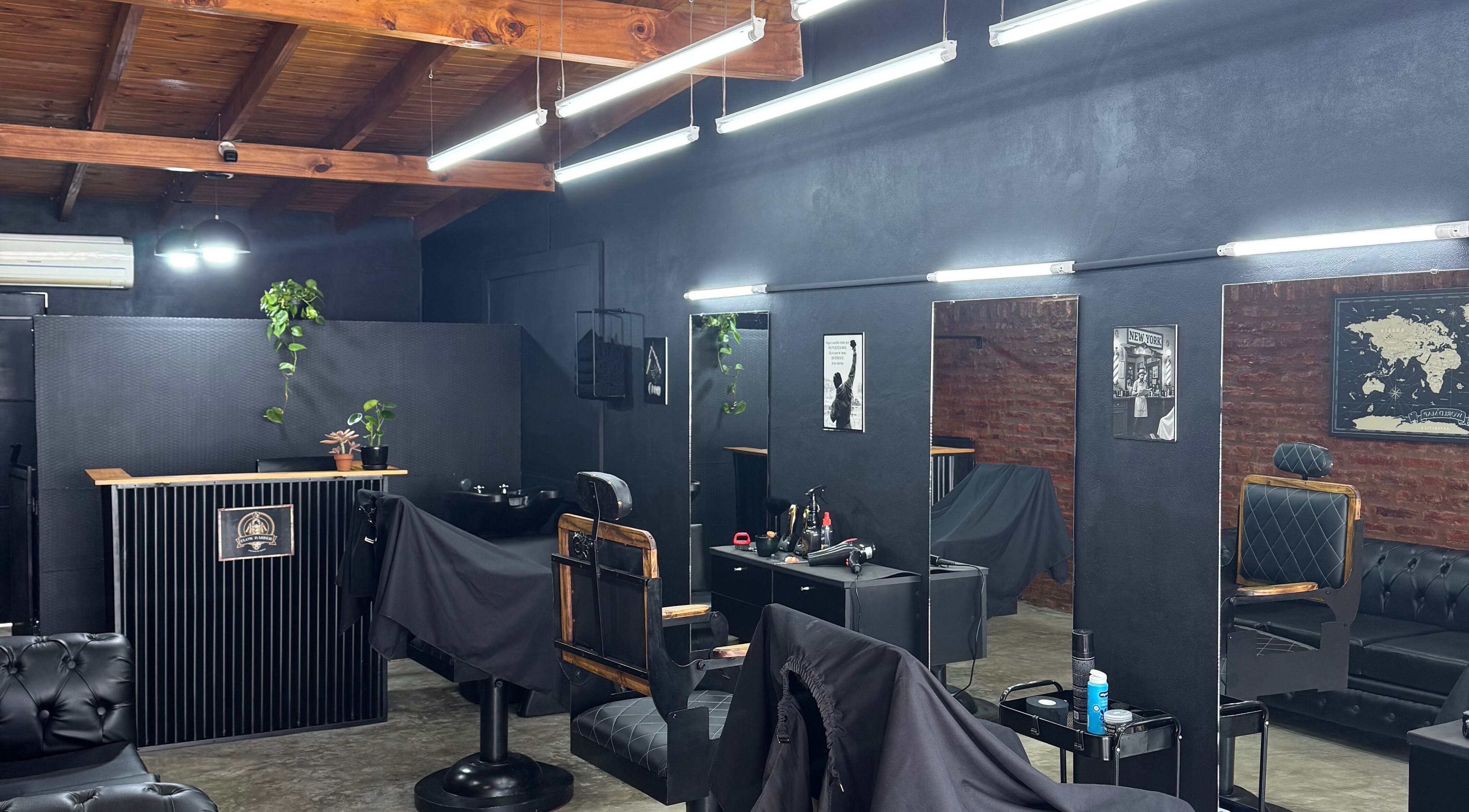 Flowbarber's stylish interior at Villa Astolfi, Provincia De Buenos Aires, AR, featuring modern decor and sleek chairs.