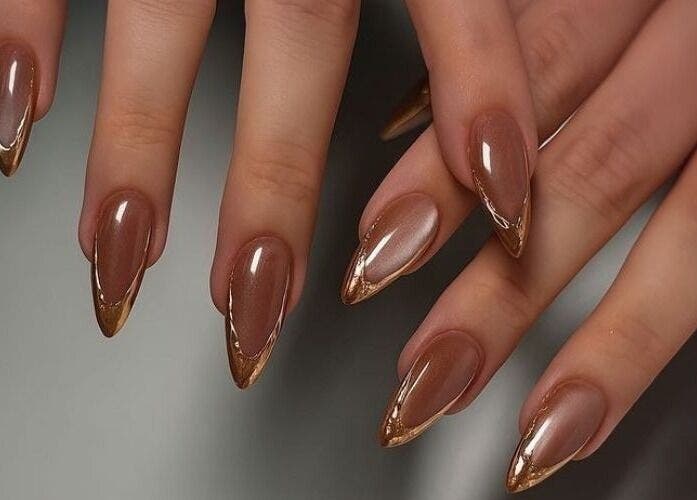 Elegant brown and gold manicure at POLISH ROOM in Ajman, Ajman, AE.