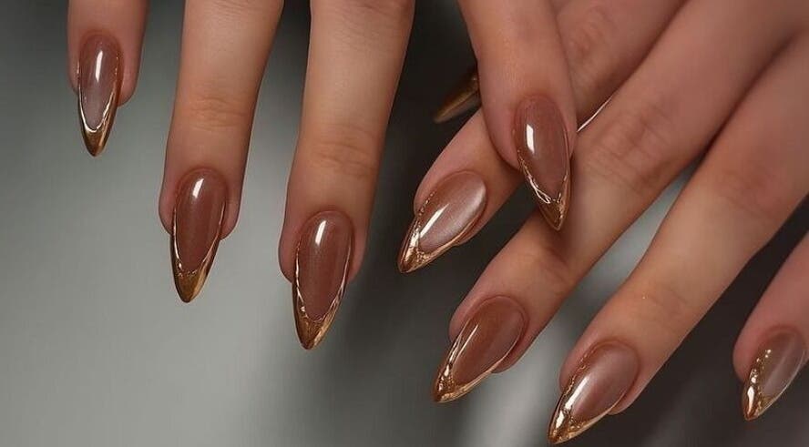 Elegant brown and gold manicure at POLISH ROOM in Ajman, Ajman, AE.