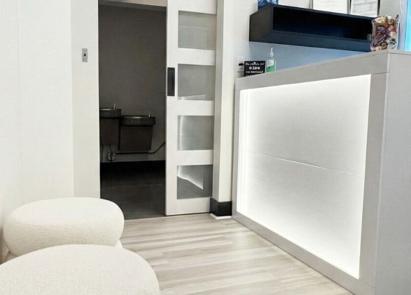 Reception area of Annie's Beauty & Body Waxing, Orlando, Florida, US, featuring modern decor and seating.