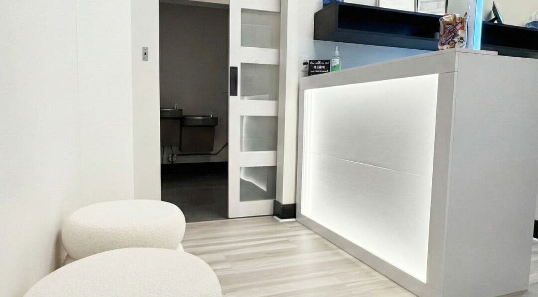 Reception area of Annie's Beauty & Body Waxing, Orlando, Florida, US, featuring modern decor and seating.