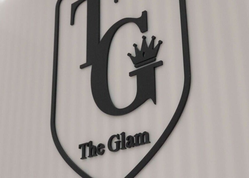 The Glam Hair&K Beauty logo wall at Toronto, Ontario, CA showcasing elegant branding.