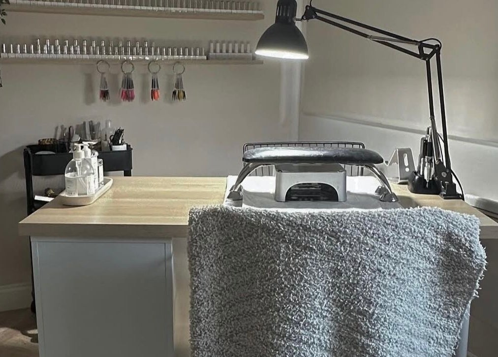 Nail station at Shape & Gloss, Stoke-on-Trent, England, GB, featuring tools and products on a neat table.
