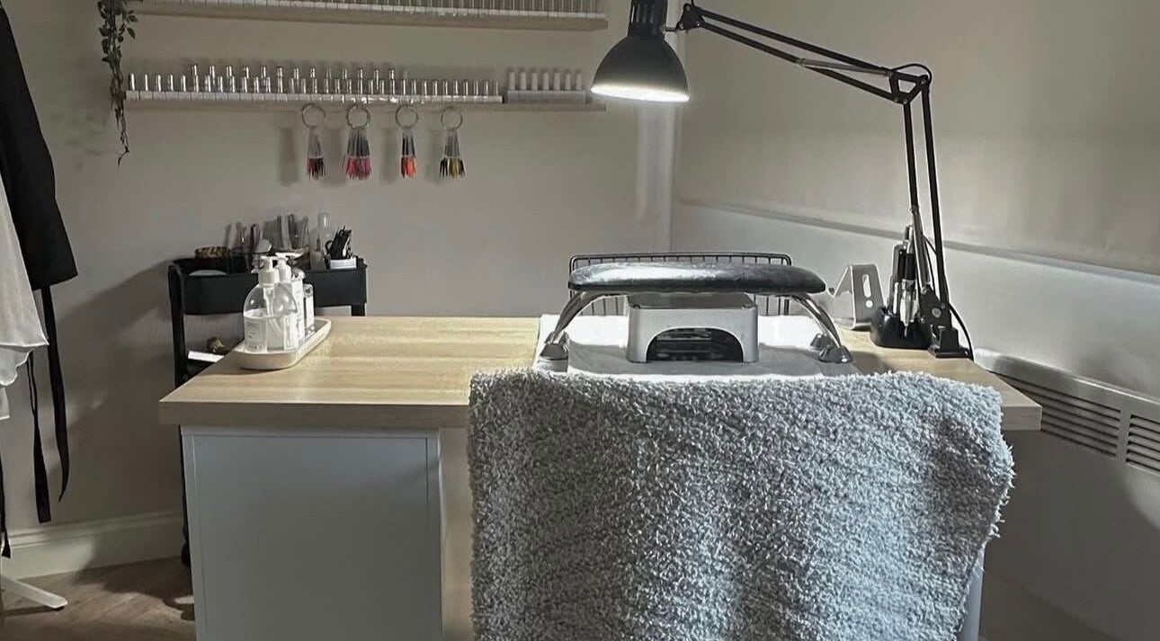 Nail station at Shape & Gloss, Stoke-on-Trent, England, GB, featuring tools and products on a neat table.