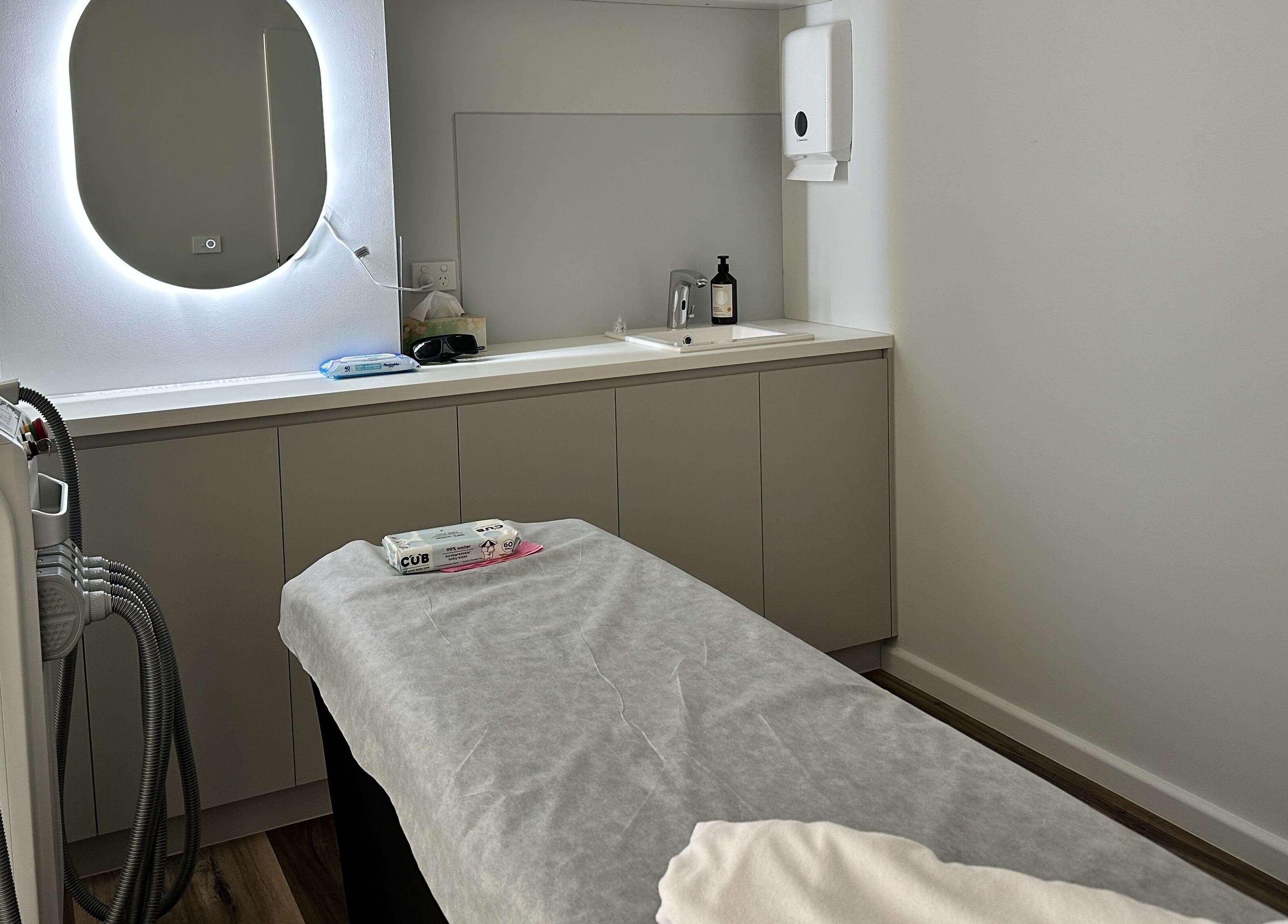 Treatment room at Beauty One Aesthetics in Melbourne, Victoria, AU featuring modern equipment and ambient lighting.