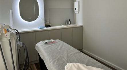 Treatment room at Beauty One Aesthetics in Melbourne, Victoria, AU featuring modern equipment and ambient lighting.