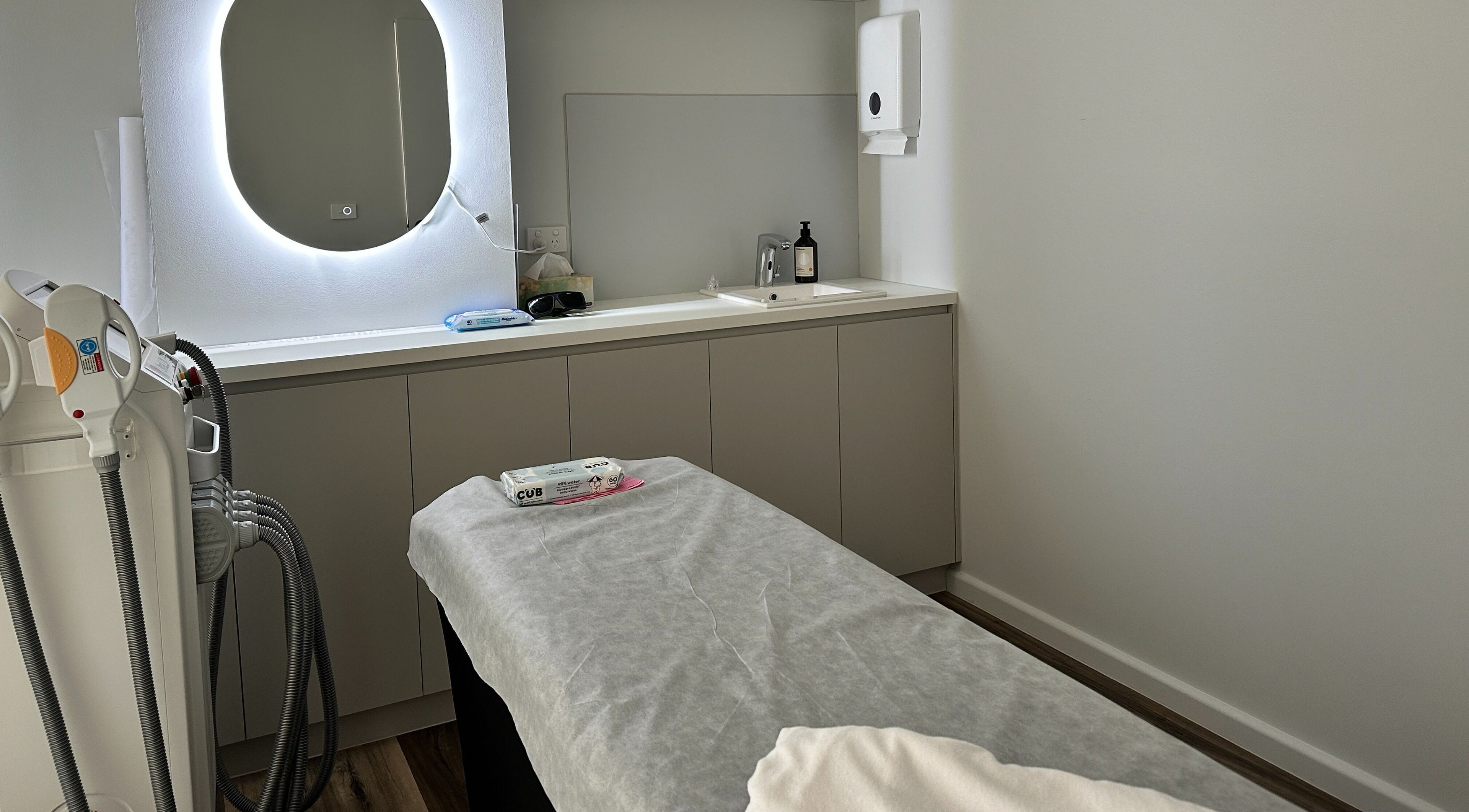 Treatment room at Beauty One Aesthetics in Melbourne, Victoria, AU featuring modern equipment and ambient lighting.