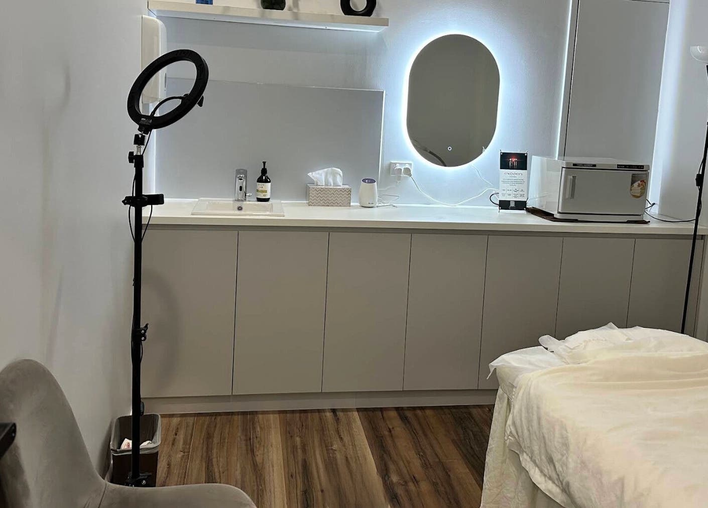 Relaxing treatment room at Beauty One Aesthetics, Melbourne, Victoria, AU with spa bed and modern decor.