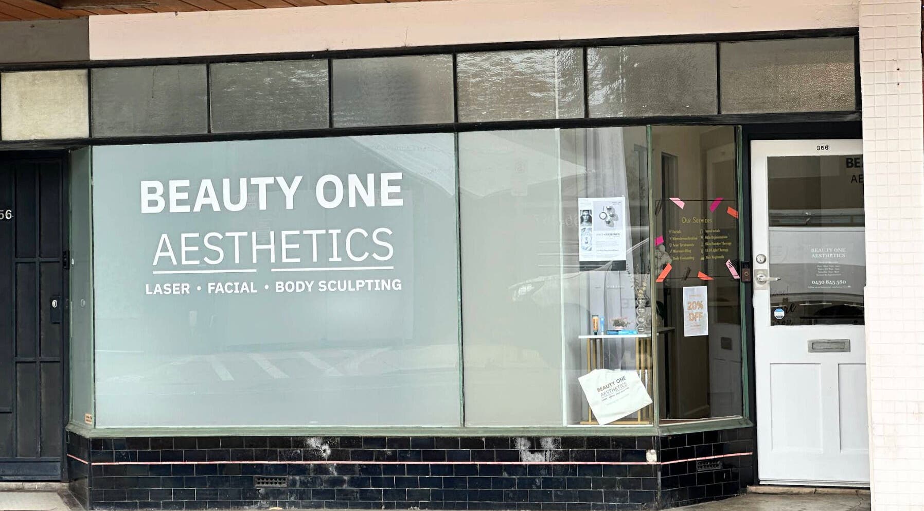 Front view of Beauty One Aesthetics in Melbourne, Victoria, AU with signage for laser, facial, and body sculpting.