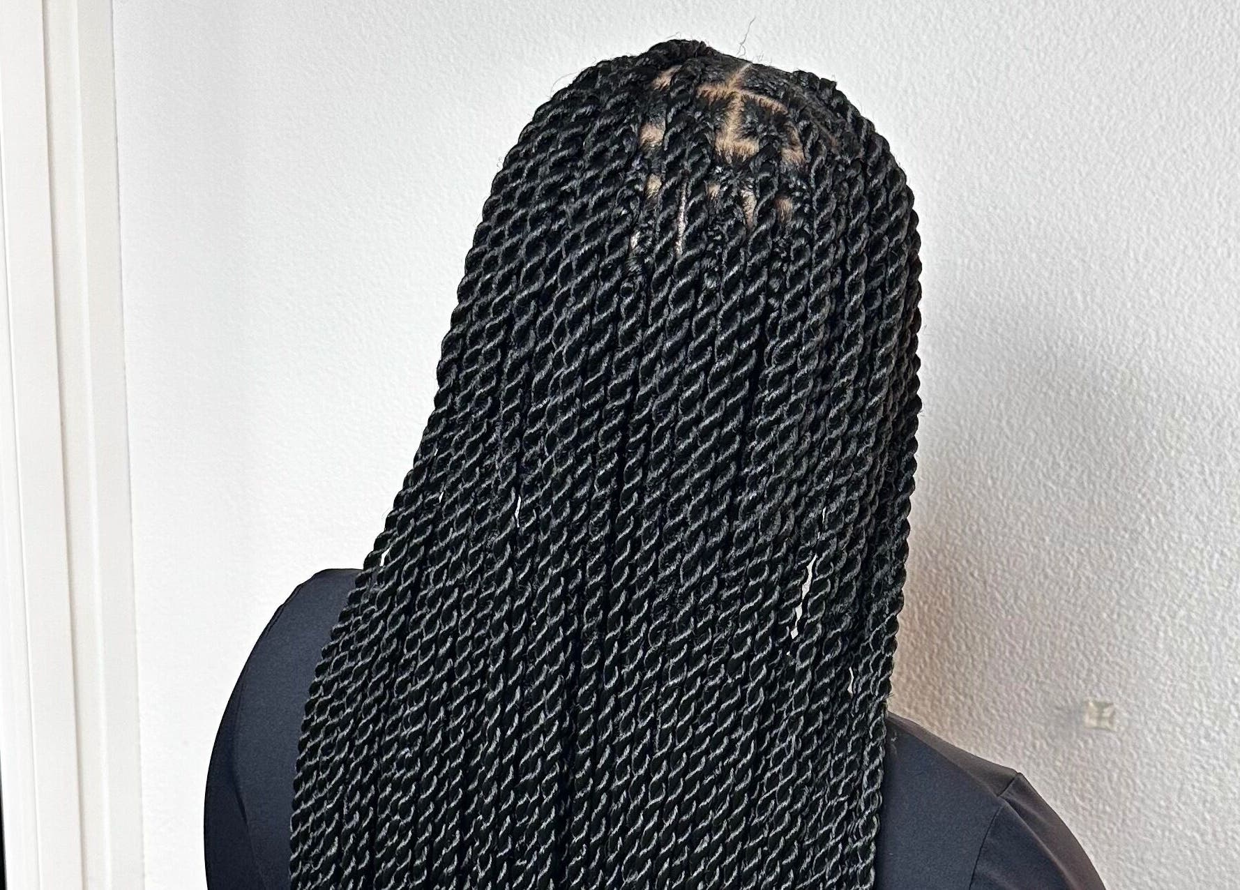 Intricate twist braids at Braids By Olma, Münsingen, Bern, CH showcase expert styling and sleek finish.