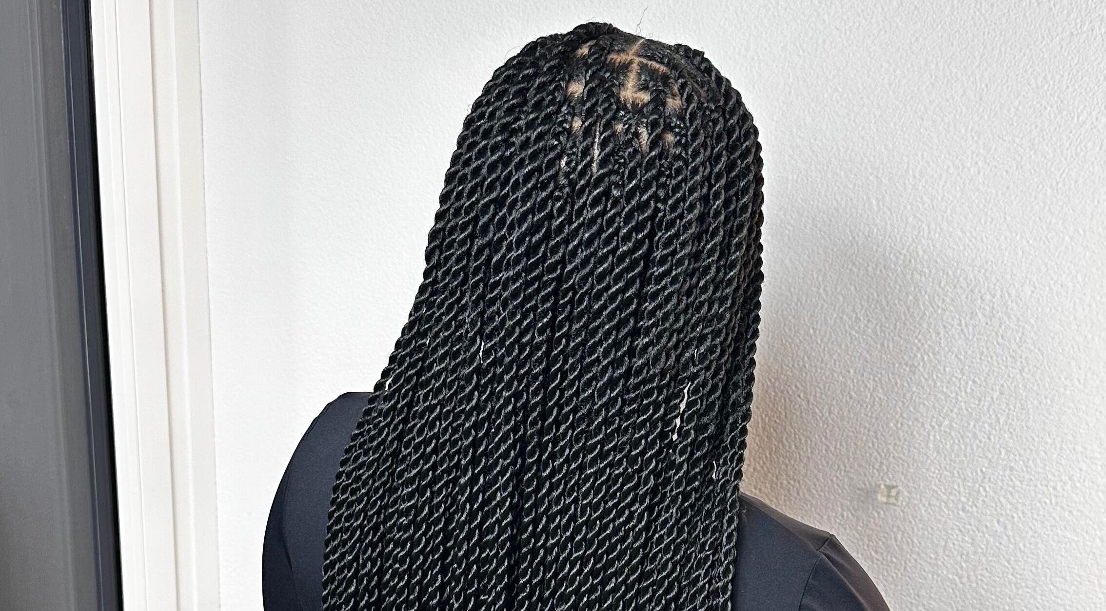 Intricate twist braids at Braids By Olma, Münsingen, Bern, CH showcase expert styling and sleek finish.