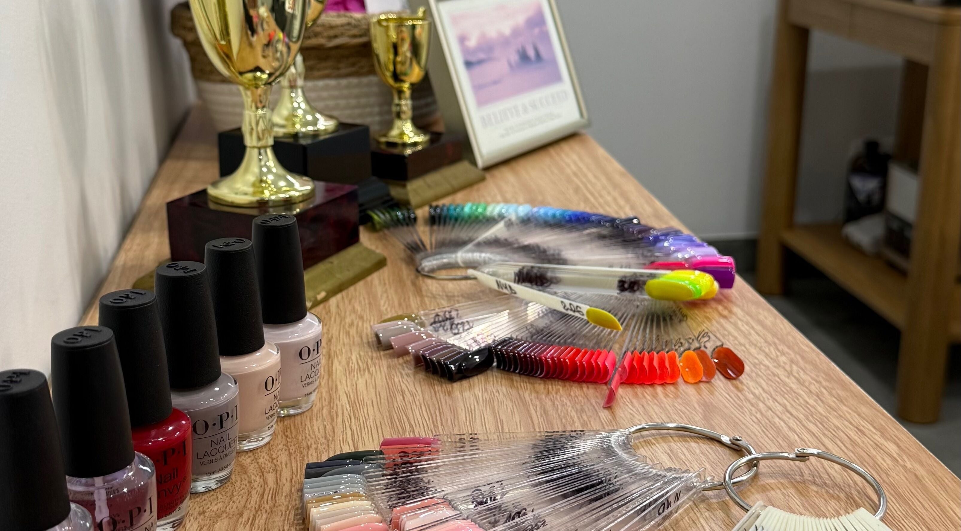 Nail polish and trophies at Amazing Nails by Anna, Bexley, New South Wales, AU showcasing vibrant colors.