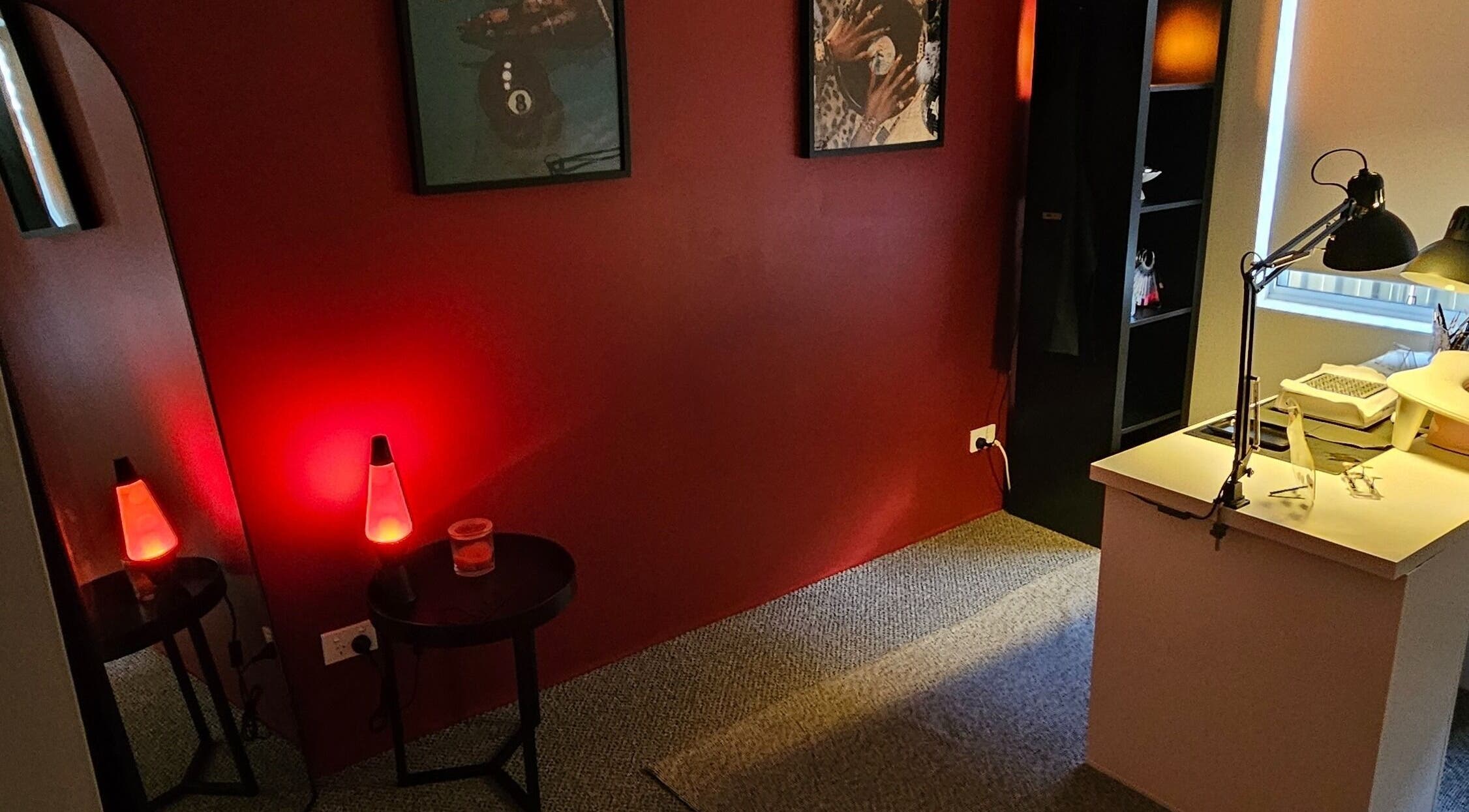 Warm, inviting interior of Polished By V in Yanchep, Western Australia, with unique lava lamp ambiance.