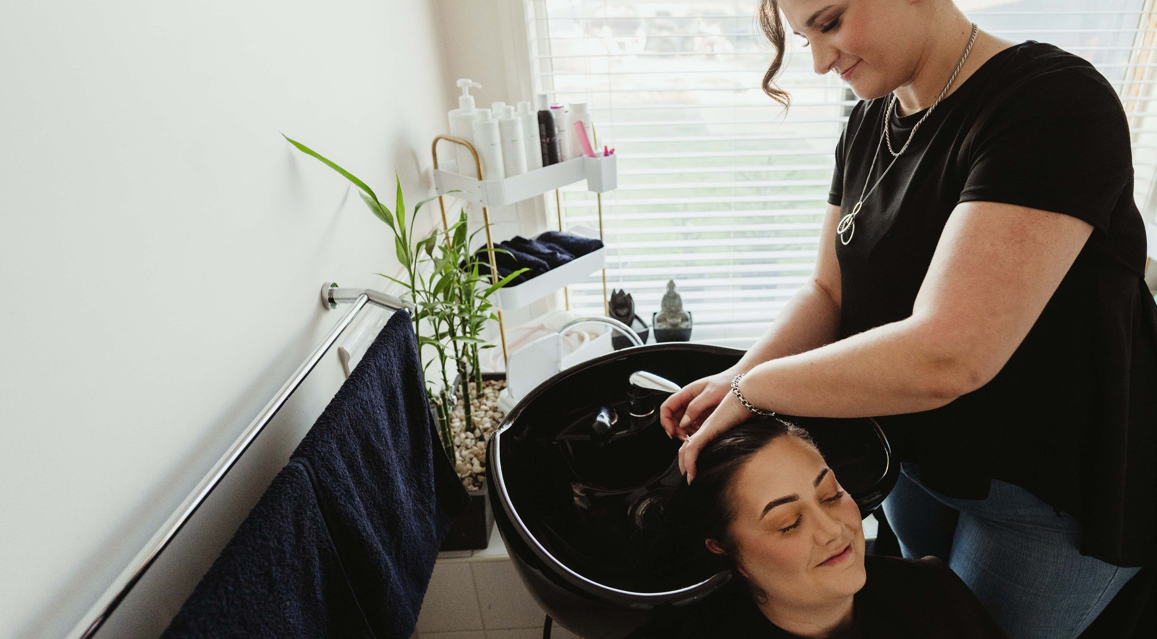 Customer enjoys a hair wash at Harmonics Hairdressing, Merbein, Victoria, AU.