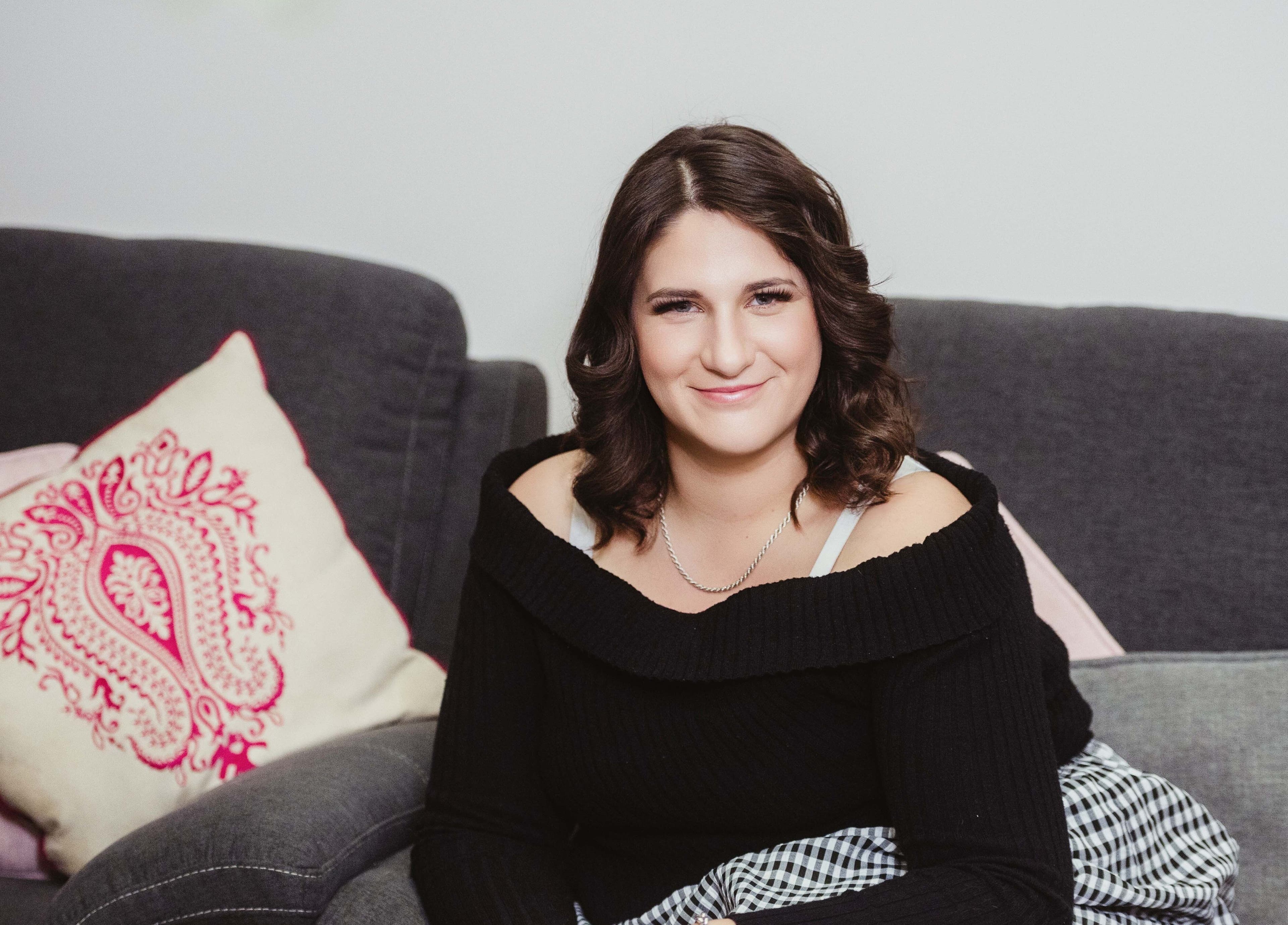 Comfortable seating area at Harmonics Hairdressing, Merbein, Victoria, AU, featuring stylish cushions.