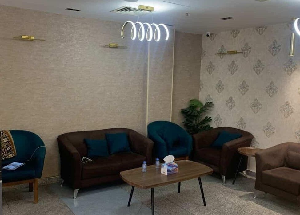 Spacious lounge at صالون حلاقه in عمّان, محافظة العاصمة, JO with modern decor and plush seating.