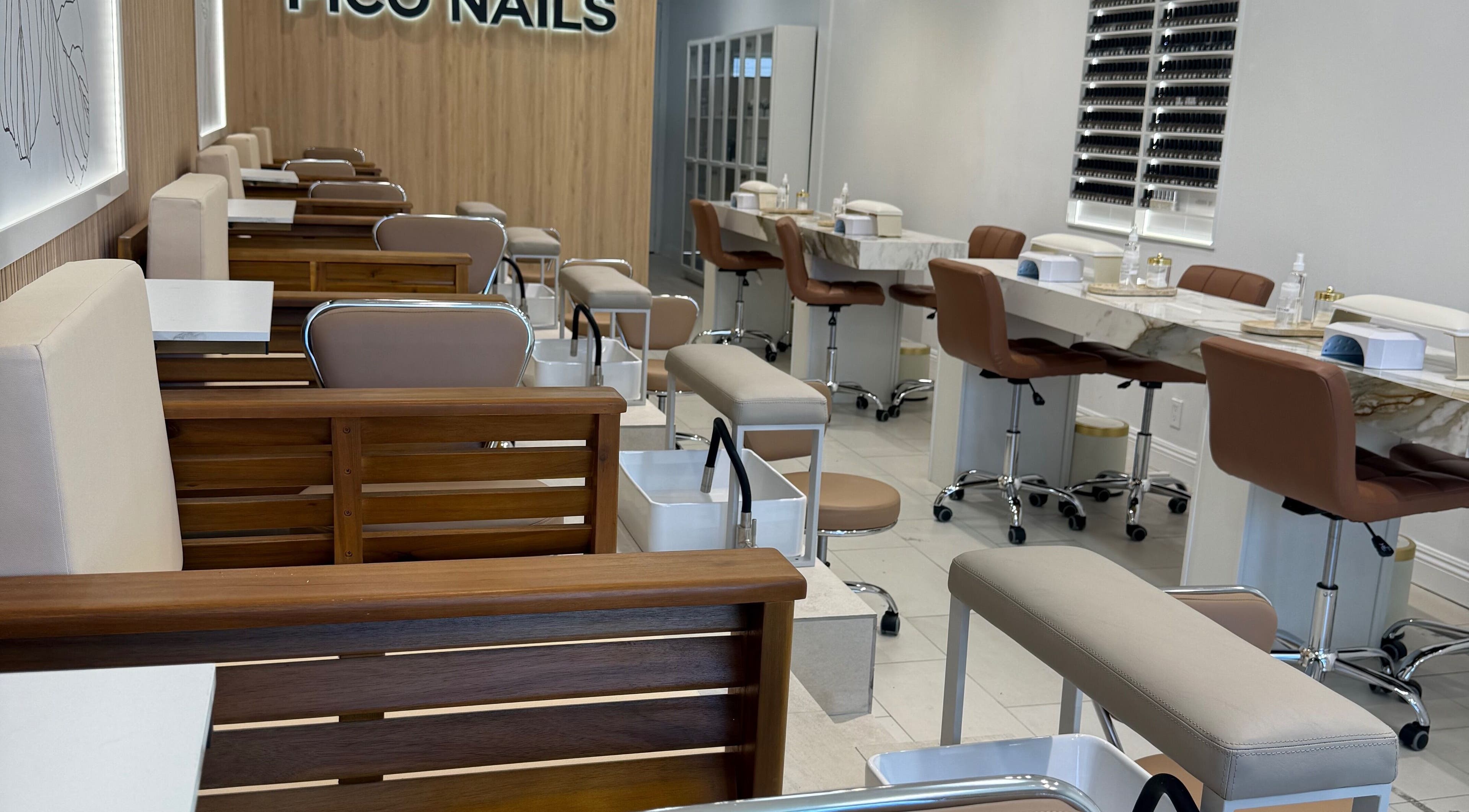 Stylish interior of Pico Nails in Los Angeles, California, US, featuring modern nail stations and cozy seating.