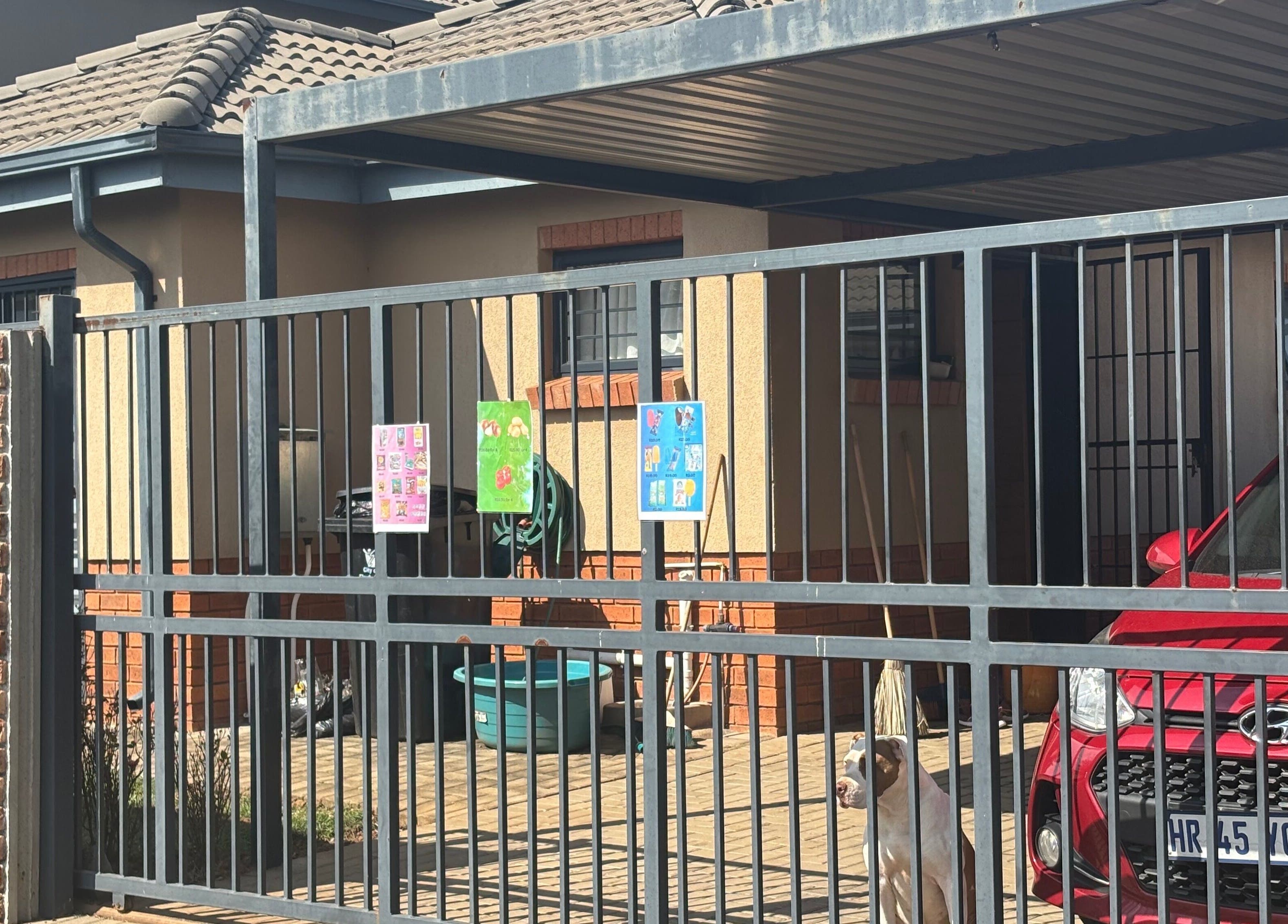 Entrance to Nails by Nelz in Alberton, Gauteng, ZA featuring a secure gate and a welcoming atmosphere.