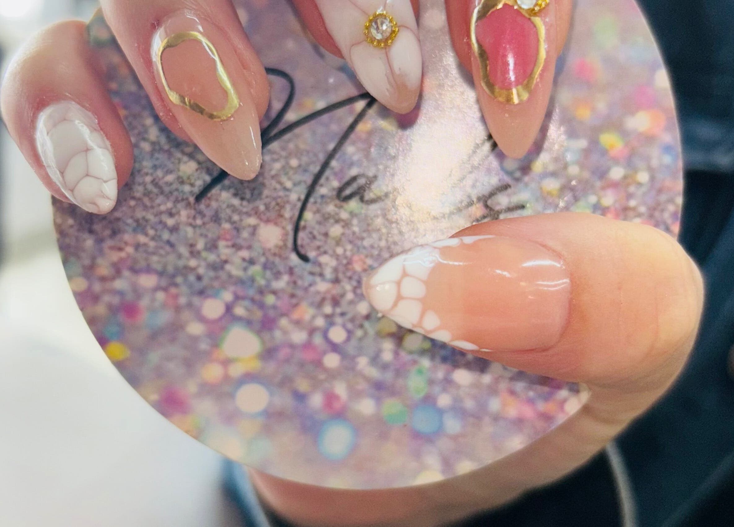 Elegant nail designs with gems at Nails by Nelz in Alberton, Gauteng, ZA showcasing artistic flair.